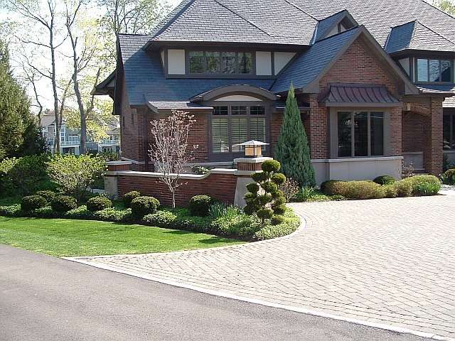 Main entrance of residence in Bratenahl Ohio, Landscape Architecture using brick walls to match the house.